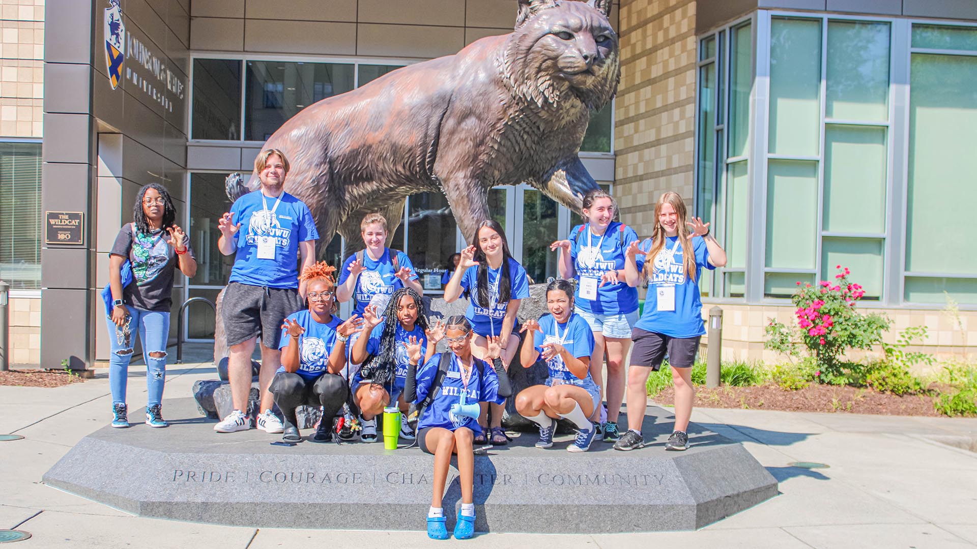 Group photo of 2024 Orientation Leaders in front of the Wildcat statue next to the Athletics Center.