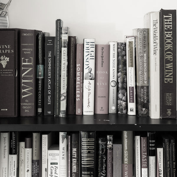 a photo of the spines of books on a shelf