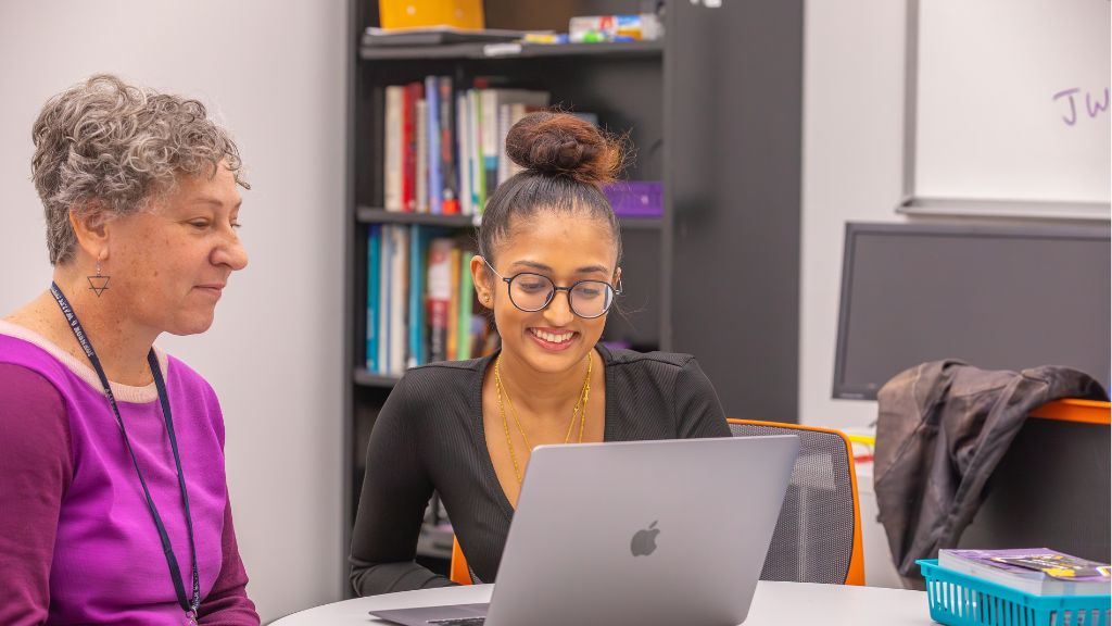 student with computer