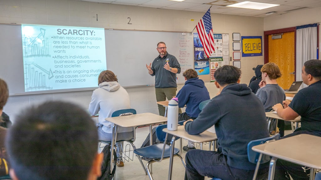 Greg Hogan, ’25 M.A.T. with his high school business students