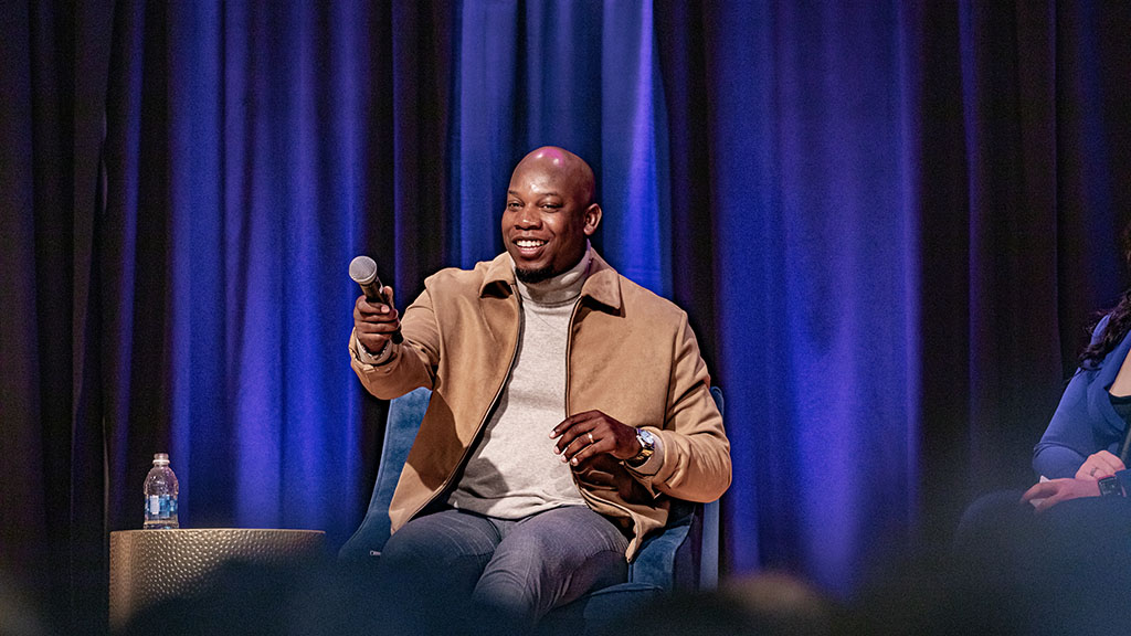 JWU alumni Aaron Lampkin onstage at SEEM Conference