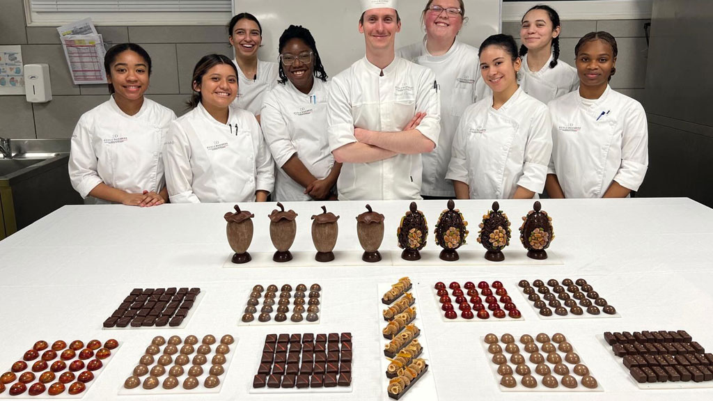 The ENSP JWU group with rows of chocolate confections created during their study abroad.