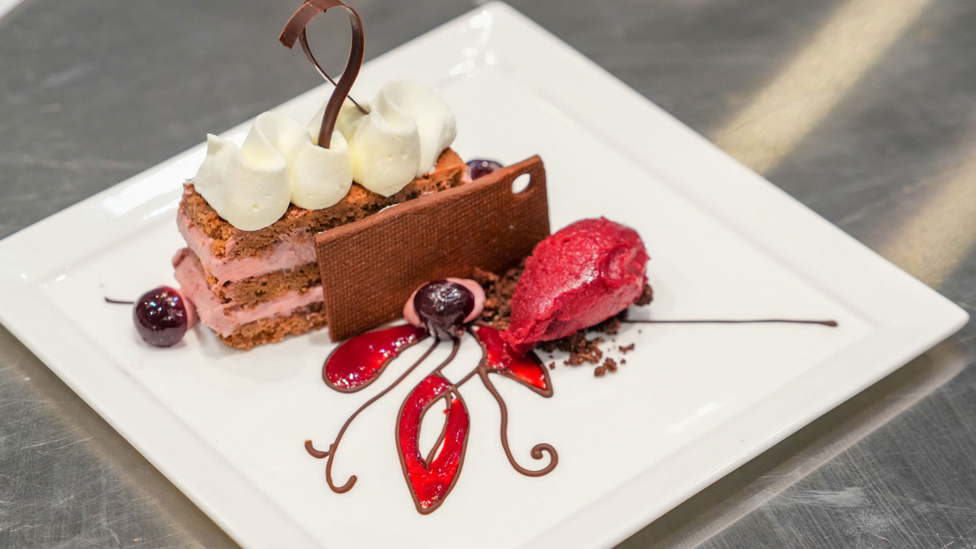 Milk chocolate sponge cake with cherry and kirsch crème Parisienne by Max Astacio '27.