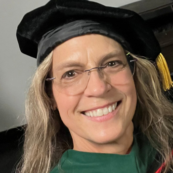a headshot of Associate Professor Lori Bechard wearing regalia