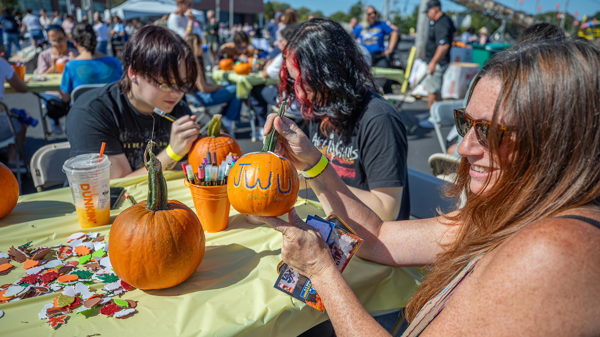 Students painting pumpkins