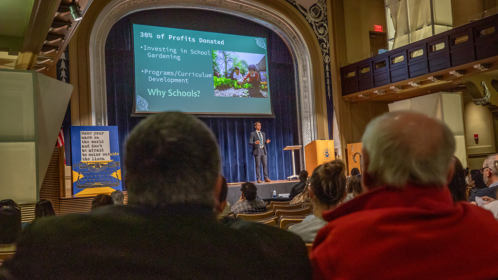 A student on stage at JWU Sharkfest