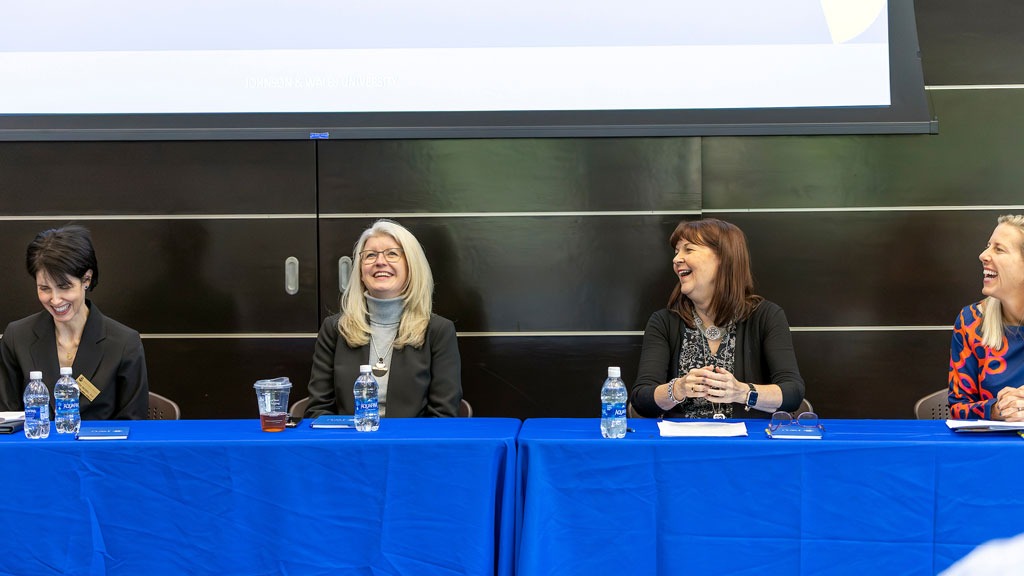 A light moment during the AI panel discussion. 