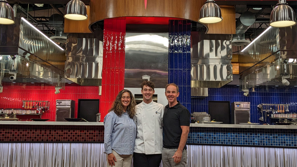 Hollis Tuffile (center) with his parents, Michelle and Charles.