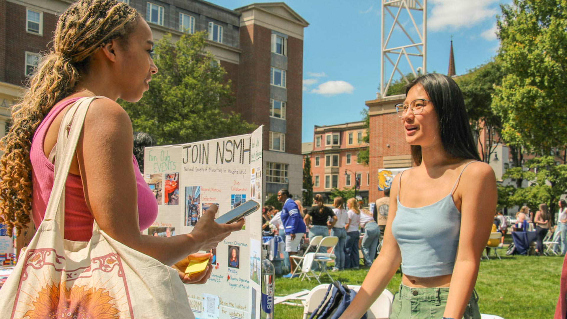 Two students talking at a table during the Involvement Fest