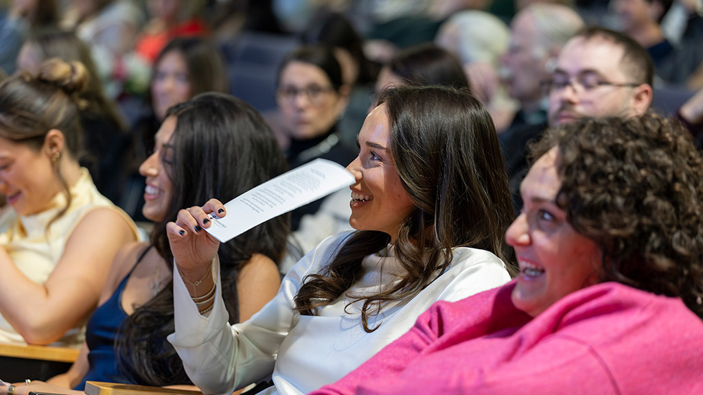 a candid shot of some ABSN 2025 cohort members at their pinning