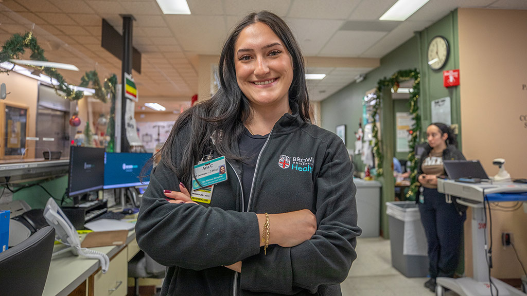 photo of Aria Coutu'26 smiling at her Brown Health internship