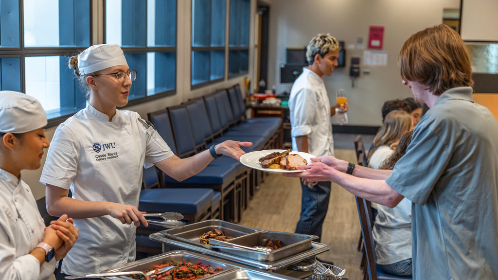 Charlotte culinary nutrition students serve their Fall into Fuel meal.