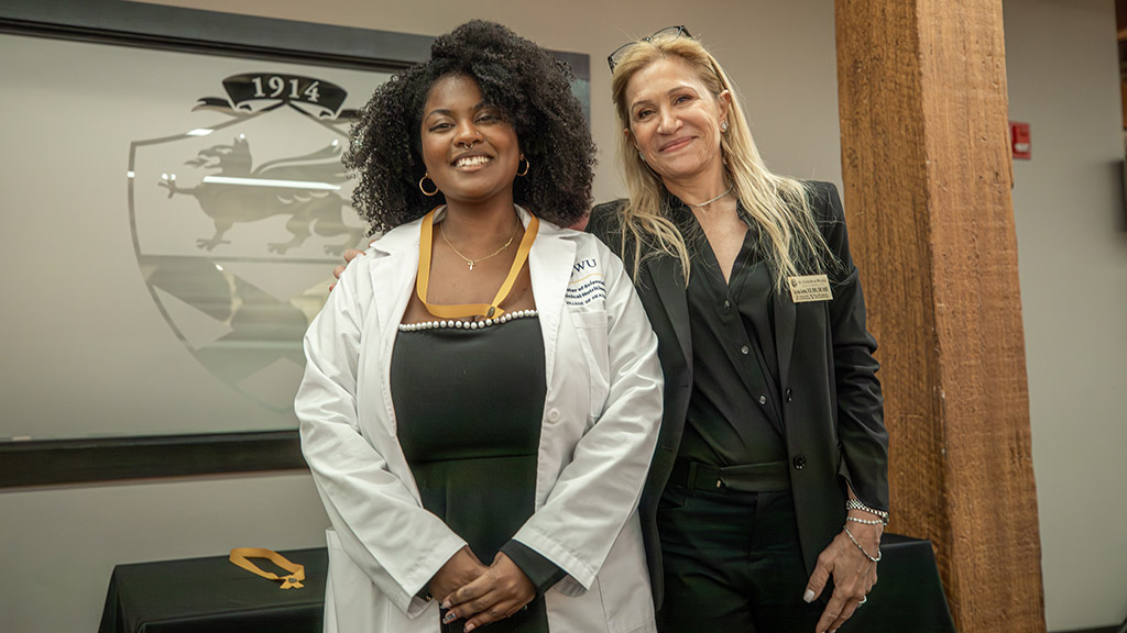 MSCND graduate Maite-Abigail Denis with director Luciana Soares