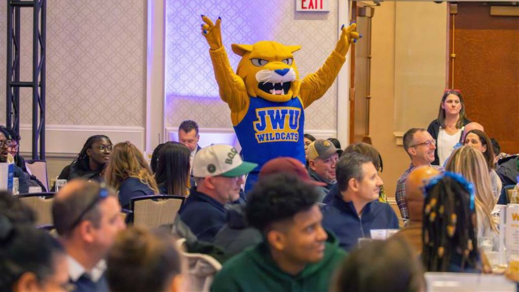 Wildcat Willie creating a disturbance during a meal for Accepted Students Day