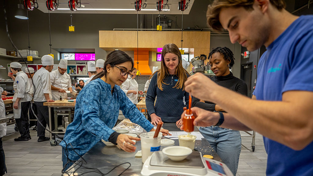 Tufts students work with JWU students in the Food Innovation & Design Lab