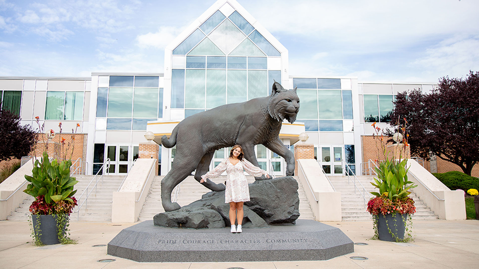Student Zayden Hill at the Wildcat Willie statue