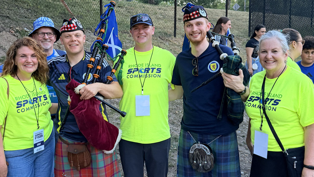 Jonathan Walker with Scottish bagpipe players who played at World Cup 2026 events in Rhode Island