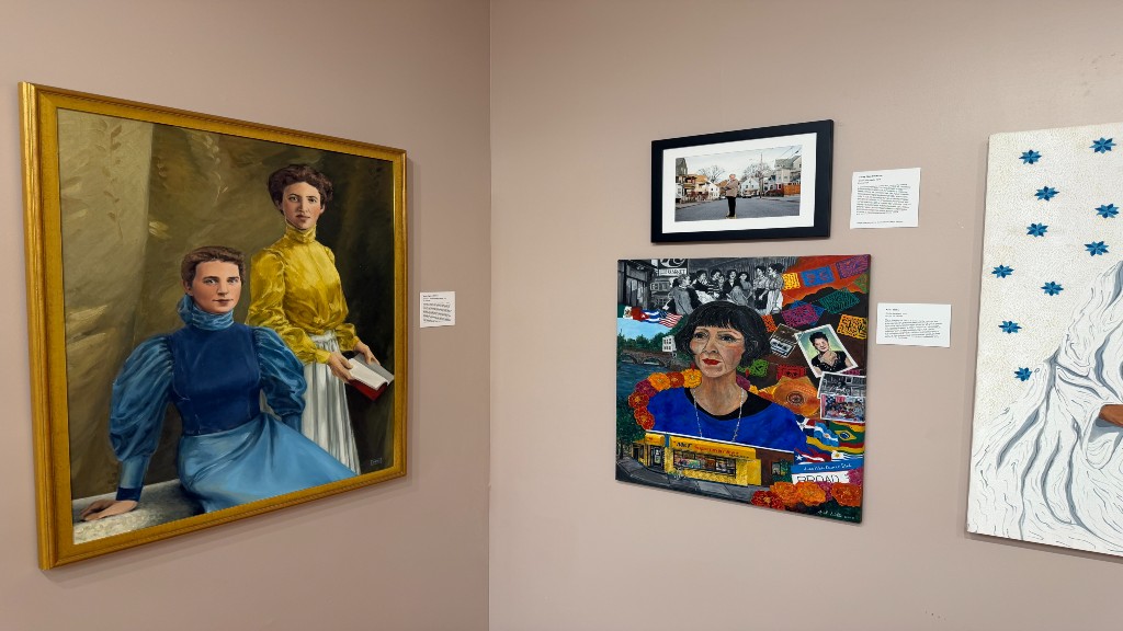 view of jwu founders portrait alongside others in exhibit